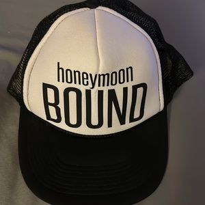 Brand new.Black & white “honeymoon bound” hat.One size fits most.Adjustable band